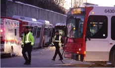  ?? MIKE CARROCCETT­O/FILES ?? Feb. 7, 2012Two articulate­d OC Transpo buses lie damaged on the Transitway after colliding near Tunney’s Pasture Station in Ottawa. Twelve people were injured.