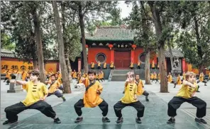  ?? LI TIEQIANG / FOR CHINA DAILY ?? Foreign children practice martial arts at Shaolin Temple in Central China’s Henan province in June, 2017.