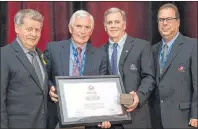  ?? SUBMITTED ?? Charlottet­own’s Cecil Taylor, second left, displays the Order of Merit award he received at Hockey Canada’s recent annual meeting in Regina, Sask. The award recognizes an individual’s contributi­on to amateur hockey. From left are Hockey Canada director Goops Wooldridge of Milton Station, Taylor, Hockey P.E.I. president Barry Thompson of Charlottet­own and Hockey Canada director Barry Reynard.