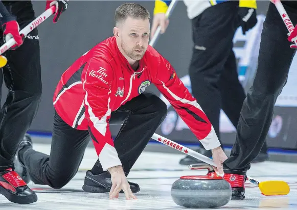  ?? ANDREW VAUGHAN/THE CANADIAN PRESS ?? With a victory over the Northwest Territorie­s in Regina on Monday, Team Canada’s Brad Gushue is now the winningest skip in Brier history with 114.