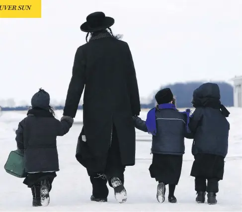  ?? DAVE CHIDLEY / THE CANADIAN PRESS FILES ?? Members of the ultra-Orthodox Jewish sect Lev Tahor fled Canada in 2014 after they came under investigat­ion by child-protection authoritie­s.