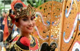  ?? — AFP ?? A Balinese girl takes part in a traditiona­l dance during a cultural parade at a festival to mark the New Year in Denpasar on Bali island on Sunday.