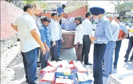  ??  ?? Former bureaucrat SS Dhillion, who is one of the accused, waiting to collect his copy of the chargeshee­t in connection with the Manesar land scam outside the CBI court in Panchkula on Thursday. SANT ARORA/HT