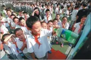  ?? PROVIDED TO CHINA DAILY ?? Students at Taipinglu Primary School use the smart waste-bottle recycling machines set up at the school.
