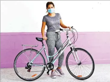  ?? AFP ?? Living in a society which casts suspicious eyes on medical workers, doctor Daniela Chavez now bicycles to work to avoid discrimina­tion.