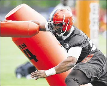  ?? AP ?? Rookie defensive end Myles Garrett went down during pass-rush drills at Wednesday’s practice. The Browns say they expect him to be ready for training camp.