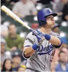  ?? MORRY GASH/ASSOCIATED PRESS ?? LA’s Cody Bellinger hit a home run in the 12th inning to lift the Dodgers to a 2-1 win over Milwaukee on Friday.