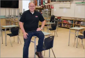  ?? BARB AGUIAR/Westside Weekly ?? Derek Smith, teacher at Mount Boucherie Secondary School, has been setting up his classroom and making sure there is room between desks as he prepares for a return to school Tuesday.