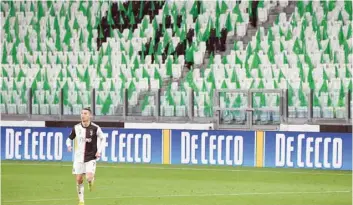  ?? — AFP ?? Juventus’ Portuguese forward Cristiano Ronaldo runs on the pitch in an empty stadium due to the novel coronaviru­s outbreak during the Italian Serie A football match Juventus vs Inter Milan, at the Juventus stadium in Turin. Ronaldo remains confined to his home in Madeira after Juventus team-mate Daniele Rugani tested positive for the new coronaviru­s, but has no symptoms, regional authoritie­s in Madeira said.