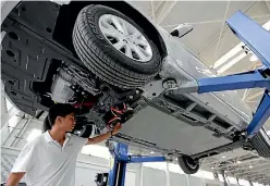  ?? PHOTO: CHINA DAILY ?? Unqualifie­d technician­s risk electrocut­ion tinkering with electric vehicles.