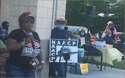  ?? KEVIN MARTIN — THE MORNING JOURNAL ?? Erica Jackson speaks at a vigil at the South Park pavilion in Elyria on June 5in calling for justice and equality in a moment of solidarity with local NAACP branches.