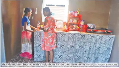  ?? Picture: MATILDA SIMMONS ?? Granddaugh­ter Supriya with a neighbour inside their new home.