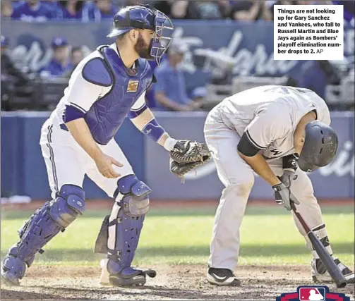  ??  ?? Things are not looking up for Gary Sanchez and Yankees, who fall to Russell Martin and Blue Jays again as Bombers’ playoff eliminatio­n number drops to 2.