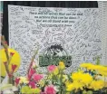  ?? LIAM RICHARDS THE CANADIAN PRESS ?? Flowers and other items adorn a vigil and a memorial on centre ice at Elgar Petersen Arena in Humboldt, Sask.