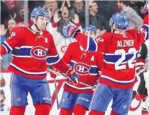  ?? JOHN MAHONEY ?? Canadiens Shea Weber, left, celebrates his goal against the Arizona Coyotes with teammates Karl Alzner and Tomas Plekanec.