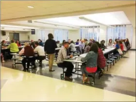  ?? PHOTOS BY EVAN BRANDT — DIGITAL FIRST MEDIA ?? About 50 parents, staff, volunteers and school board members break into discussion groups during the April 4 meeting about behavior at Pottstown Middle School.