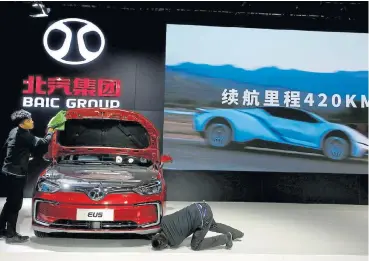  ?? /Reuters ?? Smaller brother: A BAIC vehicle in Beijing, China. The Chinese company has links to Daimler, the parent of Mercedes-Benz. Daimler tends to sell heavier cars in Europe and there is a gulf between its current emissions of 138g/km and its target of about 100g/km.
