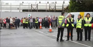  ??  ?? Hotel guests and staff in the car park of the Talbot during the evacuation drill.