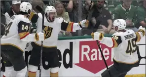  ?? (AP/LM Otero) ?? Vegas Golden Knights right wing Jonathan Marchessau­lt (center) celebrates his goal against the Dallas Stars with teammates Nicolas Hague (left) and Ivan Barbashev during the first period Tuesday night in Dallas. The Golden Knights won 4-0 to take a 3-0 lead in the NHL Western Conference final.