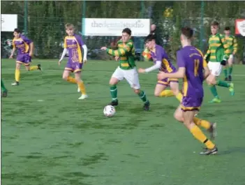  ??  ?? Hat- trick hero Todd Hynes takes the ball into the box before finishing.