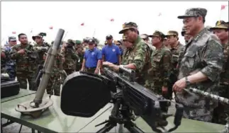  ?? HENG CHIVOAN ?? Minister of National Defence Tea Banh carries out an inspection during last year’s Cambodia-China Golden Dragon military exercises in Kompong Spue province.