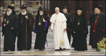  ?? ASSOCIATED PRESS ?? The Patriarch of the Syriac Orthodox Church, Moran Mor Ignatius Aphrem II (second from left), the head of the Catholicos­ate of the Great House of Cilicia of the Armenian Apostolic Church; Aram I (third from left), Pope Francis (fourth from left), Cardinal Bechara Boutros al-Rahi (fifth from left), Patriarch of Antioch and All the East for the Syriac Catholic Church, and Ignatius Youssef III Younan (right) arrive Thursday in St. Peter’s Basilica to attend a prayer for Lebanon at the Vatican.