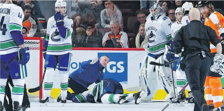  ?? — GETTY IMAGES FILES ?? In just one in a series of setbacks, the Canucks lost defenceman Alex Edler when he crashed face-first onto the ice during Monday’s game in Philadelph­ia.