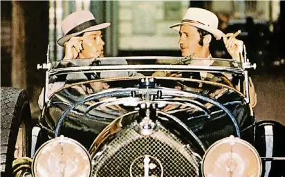  ?? FOTO: DPA ?? 1970 erschien mit „Borsalino“sogar ein Film, der den Namen des legendären Hutherstel­lers trägt. Alain Delon und Jean-Paul Belmondo spielen darin zwei Kleinganov­en – natürlich mit Hut.