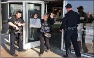  ?? AP/RICK BOWMER ?? Shoppers are evacuated from the Fashion Place mall in Murray, Utah, after a shooting Sunday just outside the building.