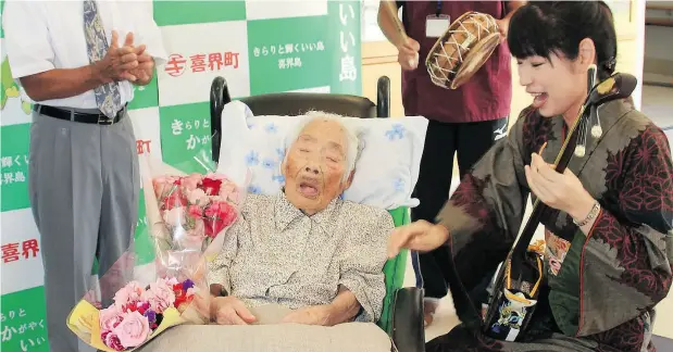  ?? KIKAI TOWN VIA / JIJI PRESS / JAPAN OUT / AFP / GETTY IMAGES ?? Nabi Tajima, shown in this photograph from September, has died. The resident of the Japanese island of Kikai was the world’s oldest person. She attributed her long life to “eating delicious things and sleeping well.” Half of all people in the world...