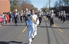  ?? RON RONE/SPECIAL TO THE COMMERCIAL APPEAL ?? Dec. 6, 2009: Freshman Derrick Grayson, Mitchell Middle/high School drum major, leads the Mitchell band in the annual Whitehaven Christmas Parade.