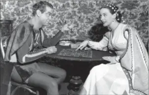  ?? FILE — THE ASSOCIATED PRESS ?? In this file photo, Alfred Drake, left, and Patricia Morison, costarring in the musical “Kiss Me Kate,” play checkers backstage at the New Century Theatre in New York. Broadway and Hollywood star Patricia Morison has died at age 103. Publicist Harlan...