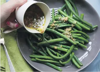  ?? THE ASSOCIATED PRESS ?? Green beans with tarragon dressing can be prepared in just 15 minutes.