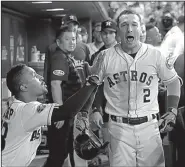  ?? AP/DAVID J. PHILLIP ?? Houston’s Alex Bregman celebrates with teammates in the dugout Saturday after hitting a home run against Cleveland’s Trevor Bauer in the seventh inning that helped the Astros beat the Indians 3-1 to take a 2-0 lead in their American League division series. Former Arkansas Razorbacks pitcher Dallas Keuchel takes the mound for the Astros on Monday with a chance to close out the series.