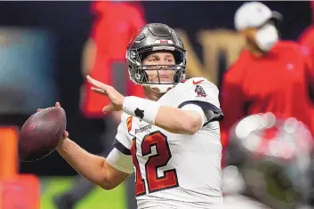  ?? BRYNN ANDERSON/ASSOCIATED PRESS ?? Tampa Bay quarterbac­k Tom Brady threw for 199 yards and two touchdowns Sunday, as he led the Bucs to the NFC Championsh­ip game following a 30-20 road win at New Orleans.