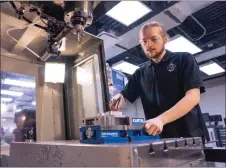  ?? SUBMITTED PHOTO ?? Thomas Oliver works on a CNC machine as part of his apprentice­ship training.