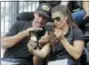  ?? DARRON CUMMINGS — THE ASSOCIATED PRESS ?? Tony Kanaan, of Brazil, and Danica Patrick take a selfie with their rings during the drivers meeting for the Indianapol­is 500 auto race at Indianapol­is Motor Speedway, in Indianapol­is Saturday.