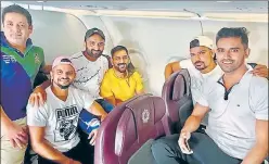  ??  ?? CSK players huddled inside a flight on way to Chennai for their preparator­y camp.