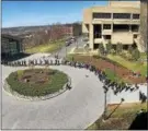  ?? JASON PARHAM ?? Protesters line the walkway to the Curtis R. Priem Experiment­al Media and Performing Arts Center on the campus of Rensselaer Polytechni­c Institute, right, while people line up at left to enter the center for college President Shirley Ann Jackson’s...