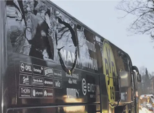  ??  ?? 0 Borussia Dortmund’s damaged coach after the explosion as the Bundesliga team travelled to a Champions League quarter-final