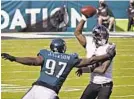  ?? KENNETH K. LAM/BALTIMORE SUN ?? The Ravens’ Lamar Jackson, right, is sacked by the Eagles’ Malik Jackson.