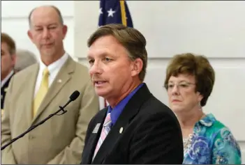  ??  ?? SCHOOL SAFETY: State Rep. Scott Baltz, of Pocahontas, center, speaks Tuesday at the Arkansas state Capitol in Little Rock as Rep. Bruce Cozart, of Hot Springs, left, and Sen. Jane English, of North Little Rock, listen during a news conference.