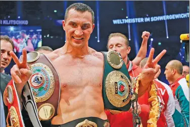  ?? Associated Press ?? Heading to the Hall of Fame: IBF, WBA, WBO and IBO champion Wladimir Klitschko, from Ukraine, celebrates after winning the IBF heavyweigh­t world championsh­ips title bout against Bulgarian boxer Kubrat Pulev in Hamburg, Germany, Saturday, Nov. 15, 2014.