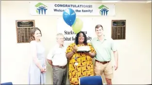  ?? ?? On Thursday, the Starkville Habitat for Humanity surprised Angela Jennings with some life-changing news: she’s getting a home. (Photo by David Smith, SDN)