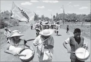  ??  ?? People march during the 10th Indigenous March to defend Mother Earth near San Jose, Bolivia, September 27, 2019. REUTERS/David Mercado