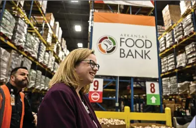  ?? (Arkansas Democrat-Gazette/Stephen Swofford) ?? Jenny Lester Moffitt, under secretary for marketing and regulatory programs for the USDA, walks through the storage area of the Arkansas Foodbank during a tour of the Little Rock facility on Tuesday.