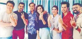  ??  ?? Left: Sajid Nadiadwala and Salman Khan (seated); Above: A group photo from the sets, including leading man Varun Dhawan (in red), David Dhawan (in blue), and leading ladies Taapsee Pannu (fourth from left) and Jacqueline Fernandez.