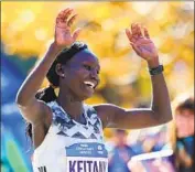  ?? Elsa Garrison Getty Images ?? MARY KEITANY of Kenya celebrates her New York City Marathon win in the second-fastest time ever.