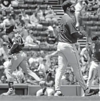  ?? NAncy lAnE PHoToS / HErAld STAFF ?? TATER TROT: Martin Perez reacts as Toronto’s Lourdes Gurriel Jr. rounds the bases after hitting a home run in the first inning as the Blue Jays bashed eight homers on Sunday. Below, Marwin Gonzalez pitched a scoreless eighth inning.