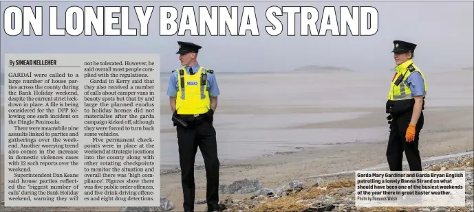  ?? Photo by Domnick Walsh ?? Garda Mary Gardiner and Garda Bryan English patrolling a lonely Banna Strand on what should have been one of the busiest weekends of the year there in great Easter weather.